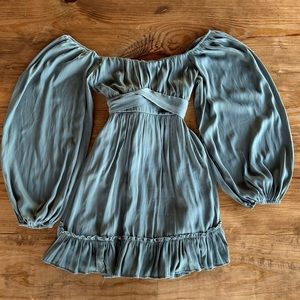 Satin green dress. Zip up back. Extra tie for the waist on the back.